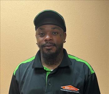 cetrick posing for employee photo with SERVPRO gear on