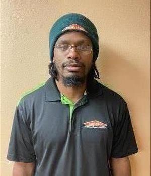 Black male with glasses and SERVPRO shirt on