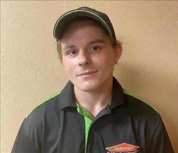white male with a black hat and SERVPRO shirt on